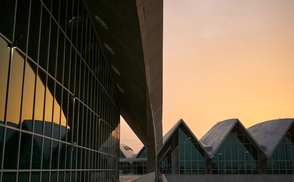 Modern building architecture against a warm sunset sky